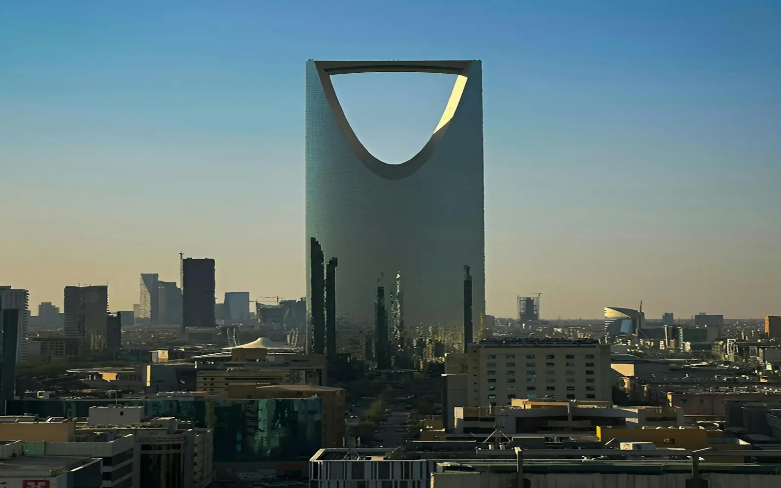 Kingdom Centre tower rising above the Riyadh skyline at dusk