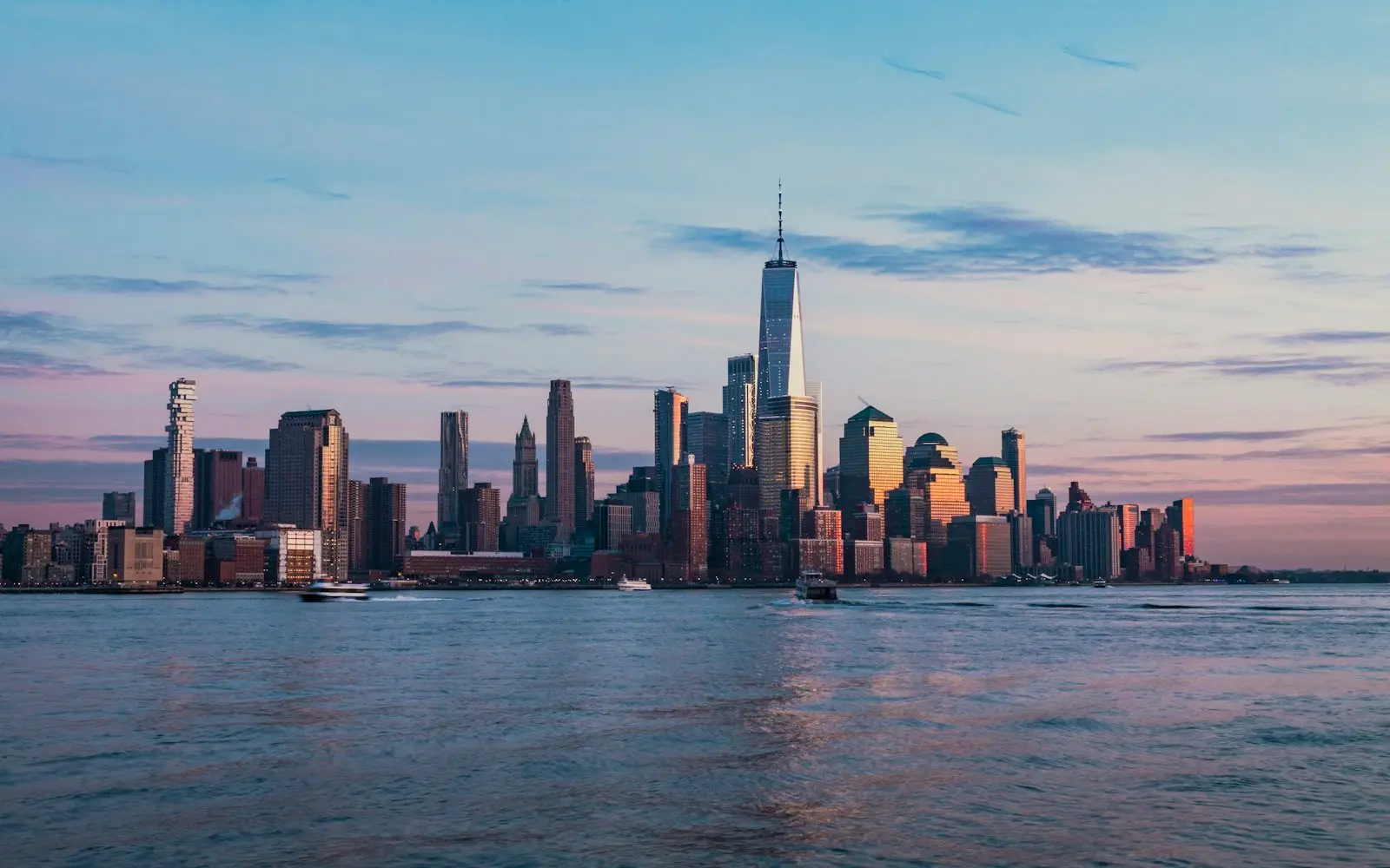Lower Manhattan skyline across the Hudson River at blue hour